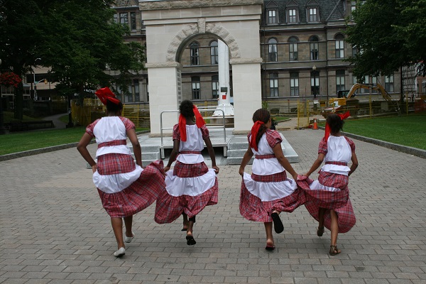 girls in national dress running